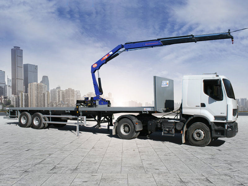 Camion plateau équipé de gru